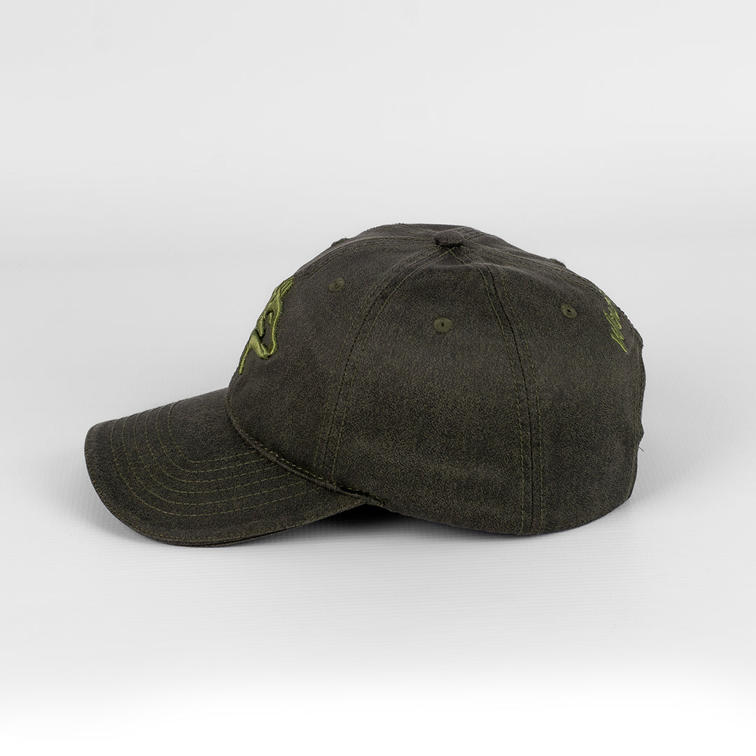 Alternate side view of the Wolf Rock Oil Skin cap in Olive.