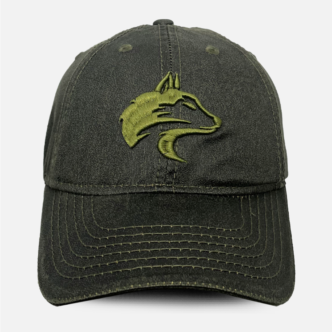Front view of the Wolf Rock Olive Oil Skin Cap showing the waxed texture.