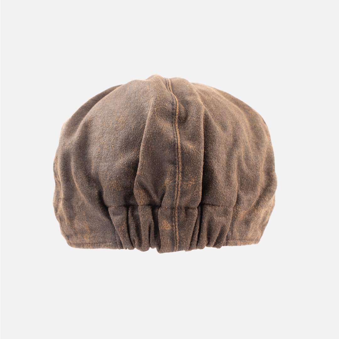 Rear view of the Wolf Rock Oilskin Flat Cap, showing the dark, waxed finish