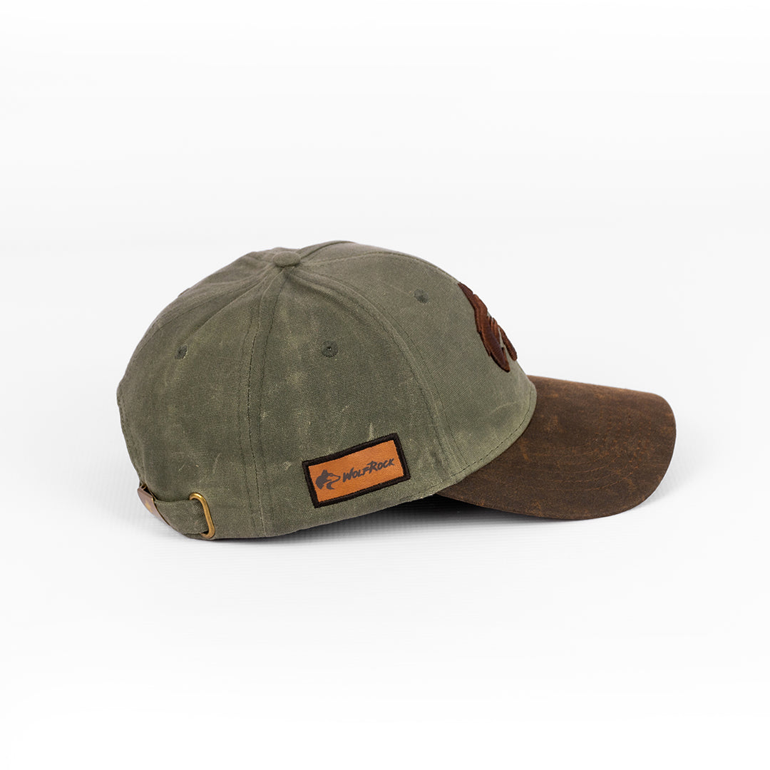 Side profile of the Wolf Rock Waxed Cap, showing the structured shape.